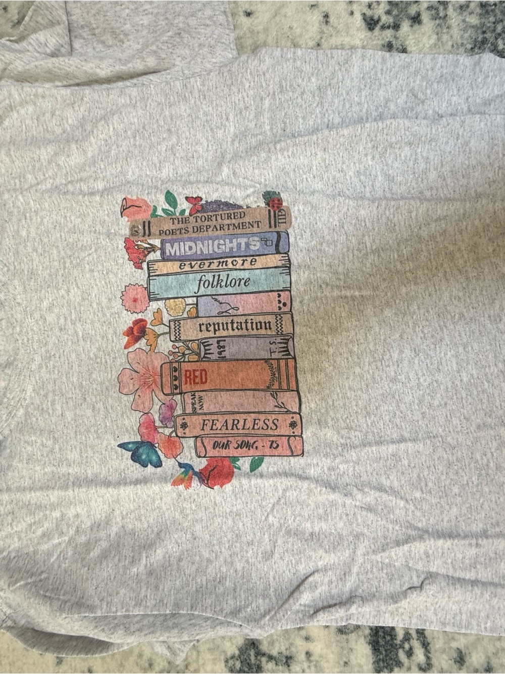 Graphic Taylor Swift Eras Book Tee - Light Gray with Pastel Floral Print